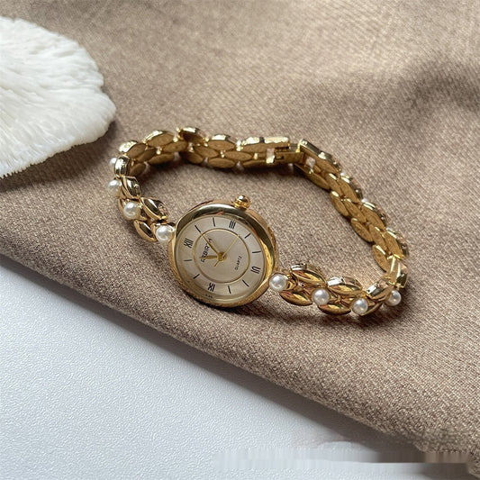 Montre-bracelet pour femme avec bracelet métallique et perles