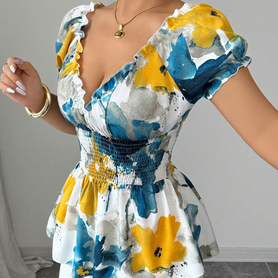 Damenbluse mit tiefem Ausschnitt mit Blumendruck und Schößchen - Yelina