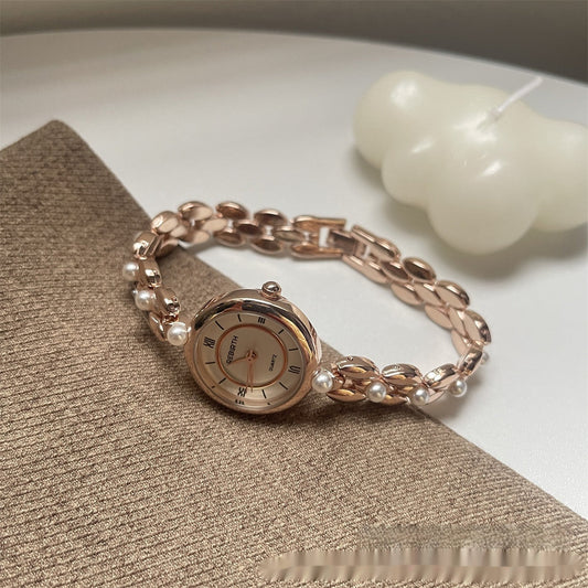 Montre-bracelet pour femme avec bracelet métallique et perles