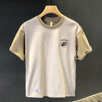 Basic-T-Shirt aus Baumwolle mit minimalistischem Aufdruck im urbanen Stil - Damián