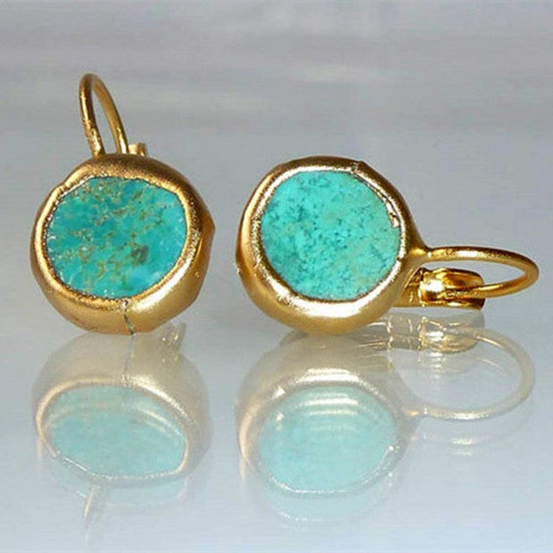 Boucles d'oreilles féminines rondes avec pierre décorative
