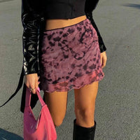 Nadia - Mini-jupe superposée tendance avec imprimé abstrait