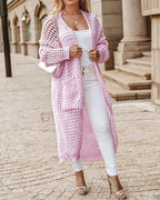 Strickjacke mit Taschen in Ausschnittform und längerer Länge