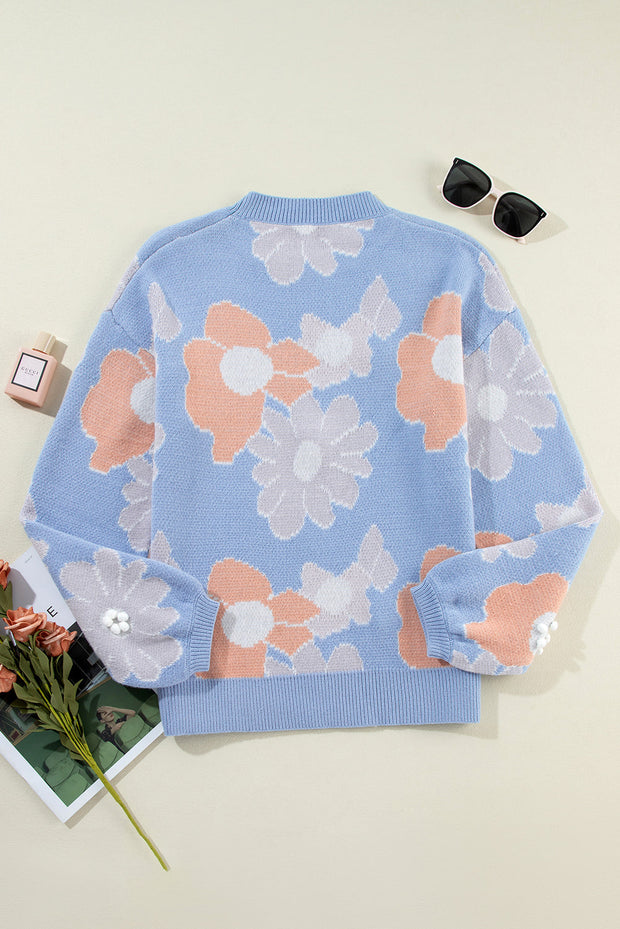 Blanche - Blauer Strickpullover mit Rundhalsausschnitt und Blumenmuster mit hängenden Schultern