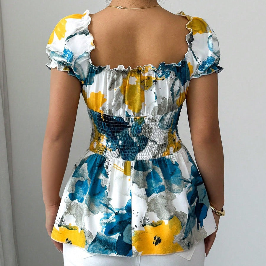 Damenbluse mit tiefem Ausschnitt mit Blumendruck und Schößchen - Yelina
