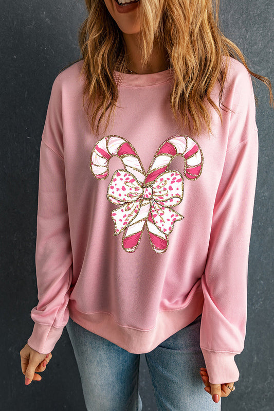 Claire - Sweatshirt Épaules Tombantes à Graphisme de Noël et Nœud Rose
